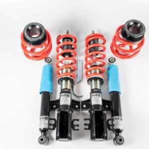 Car suspension components with red springs and shocks.